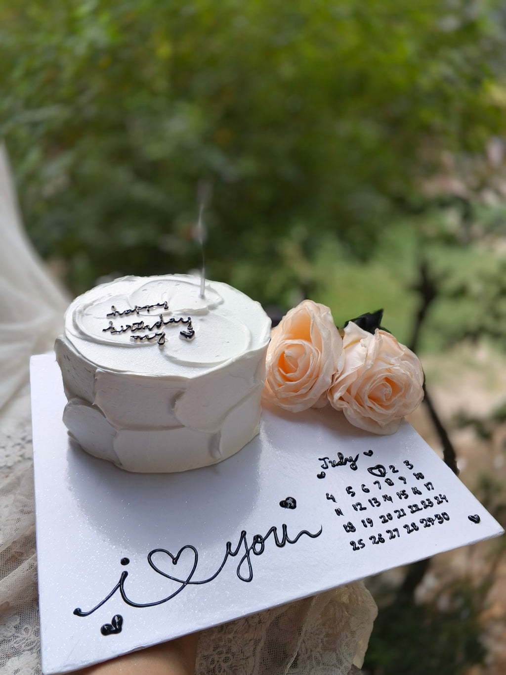 1 pound chocolate cake with board designing in two pounds size and apray roses large