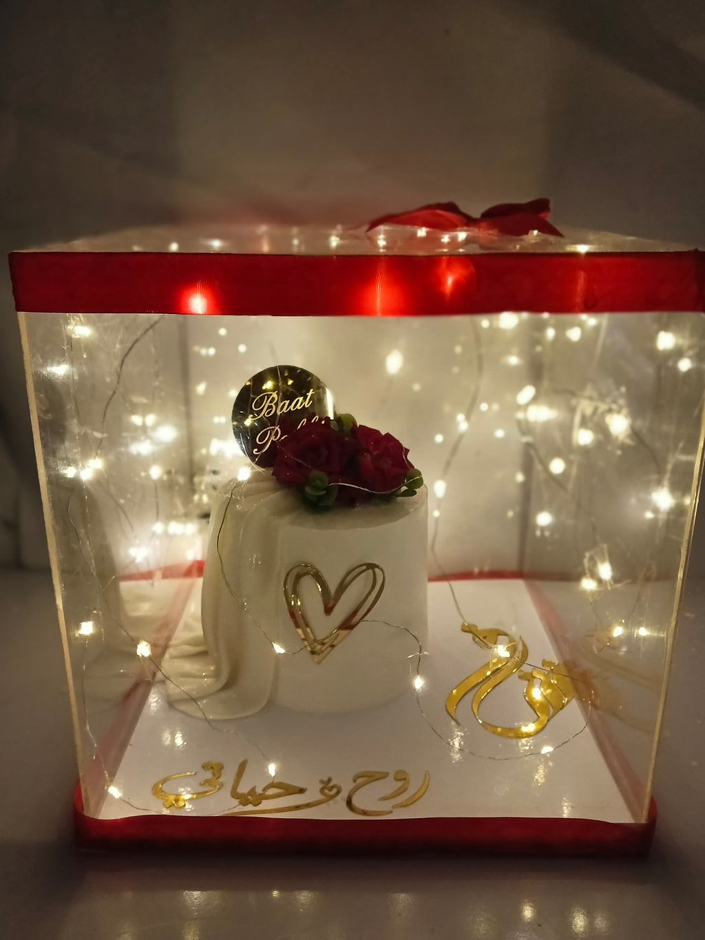 bat pakki cake in acrylic box with kights nad ribbo decore