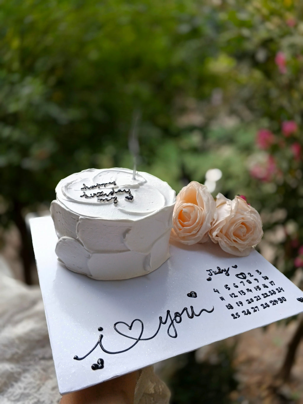 1 pound chocolate cake with board designing in two pounds size and apray roses large